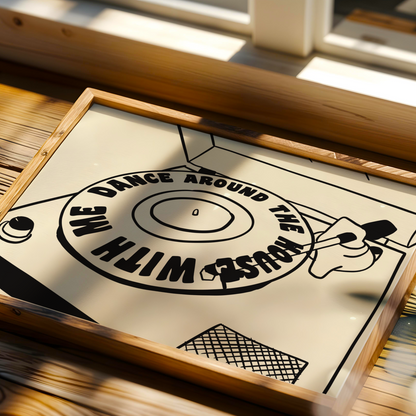 Framed artwork with a vinyl record design on a wooden surface