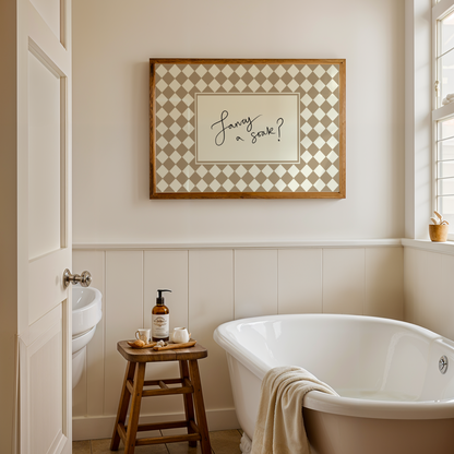 Bathroom with freestanding bathtub, sink, and decorative wall art.