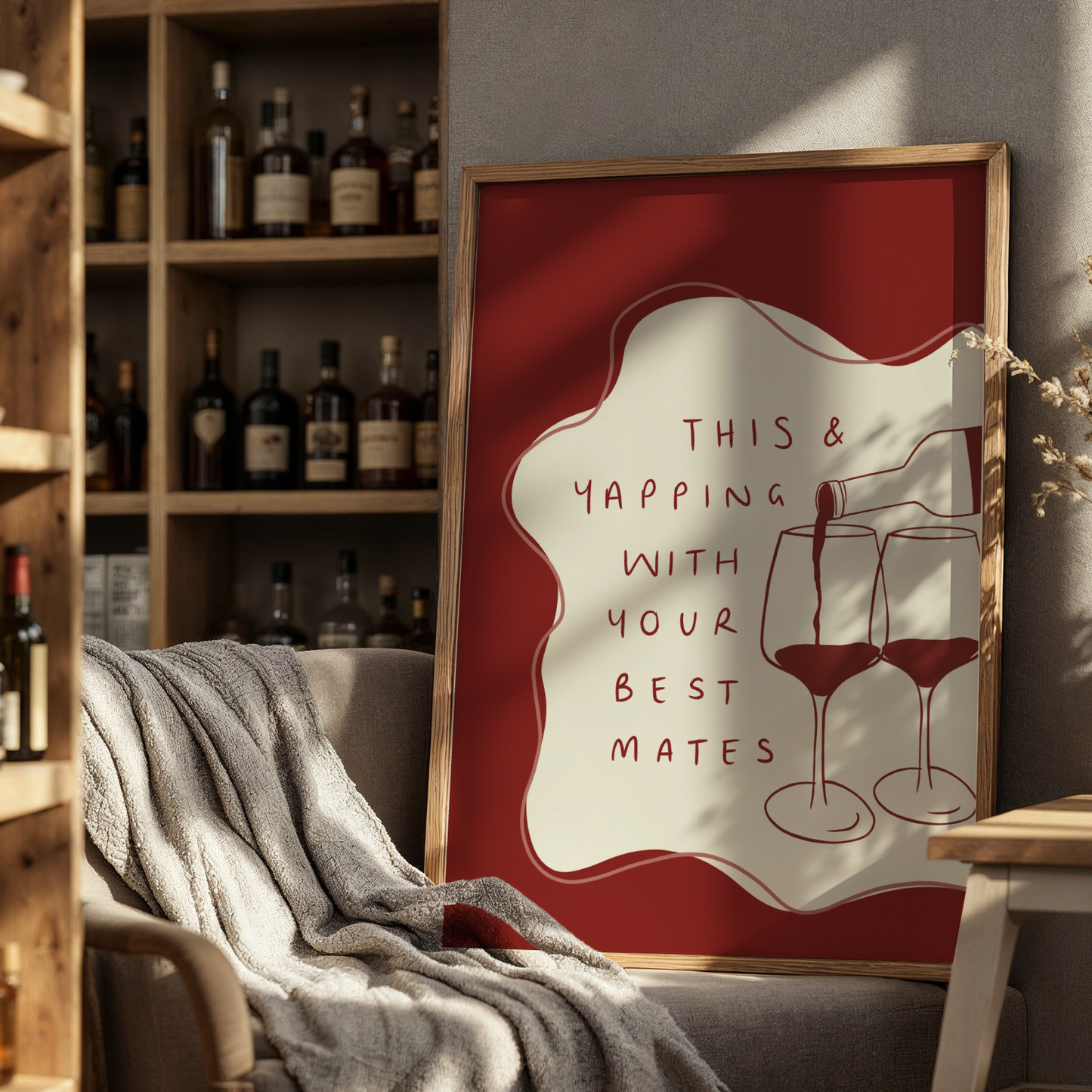 Framed artwork with wine-themed text in a cozy room with shelves and decor.